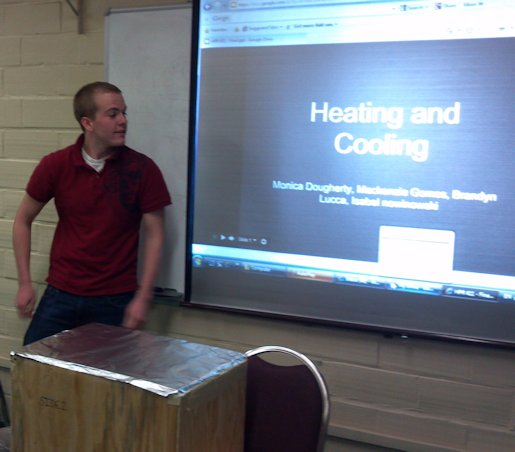 URI Honors class presenter discussing passive heating and cooling projects.